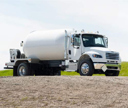 Propane delivery truck driving on road