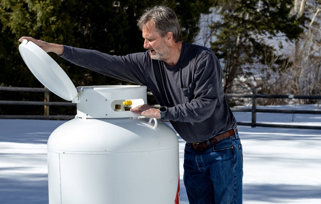 Man inspecting propane tank
