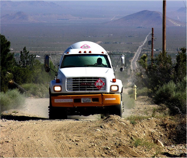 Propane delivery truck driving on road
