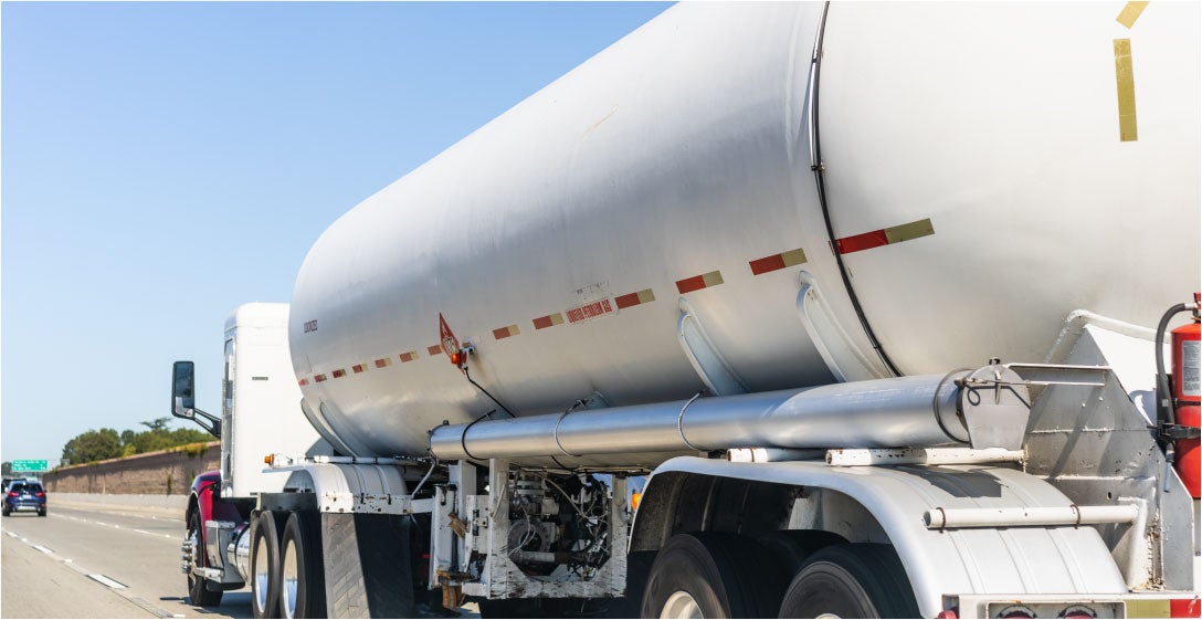 Propane truck driving on highway