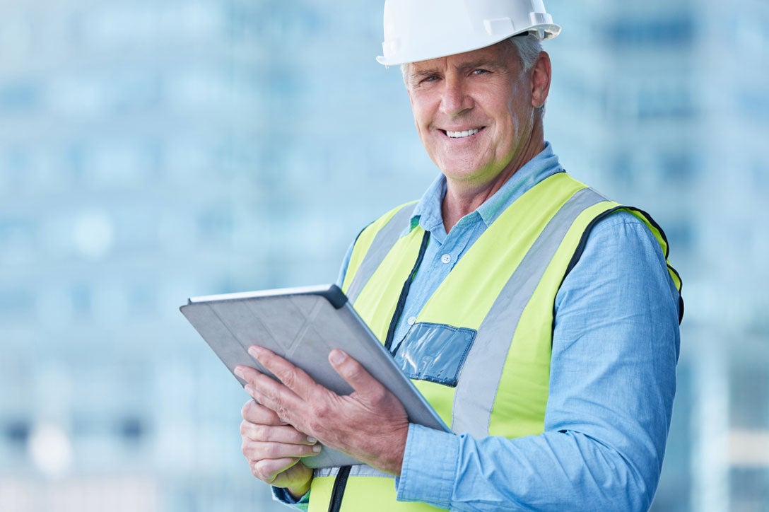 Man watching training videos on tablet